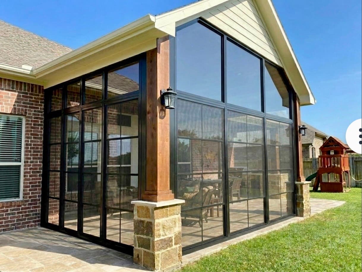 Brick home porch converted to enclosed screened addition with cathedral ceiling by Vivid Outdoor Living